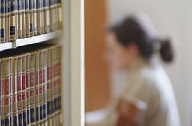 a student studies in the stacks at Julien and Virginia Cornell Library at VLS